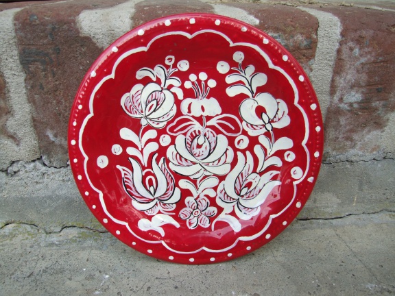 Leuk rood wandbordje, wit beschilderd