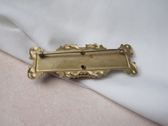 Broche medaillon antiek goudkleurig met zilverkleurig frontje 7.6x2.8 cm - Afbeelding 3